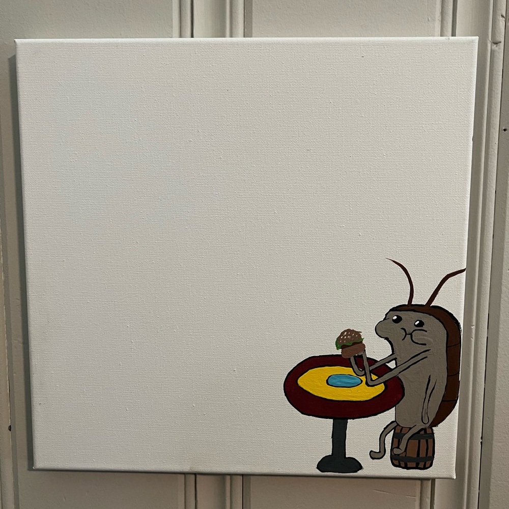 Handmade SpongeBob cockroach eating krabby patty at table